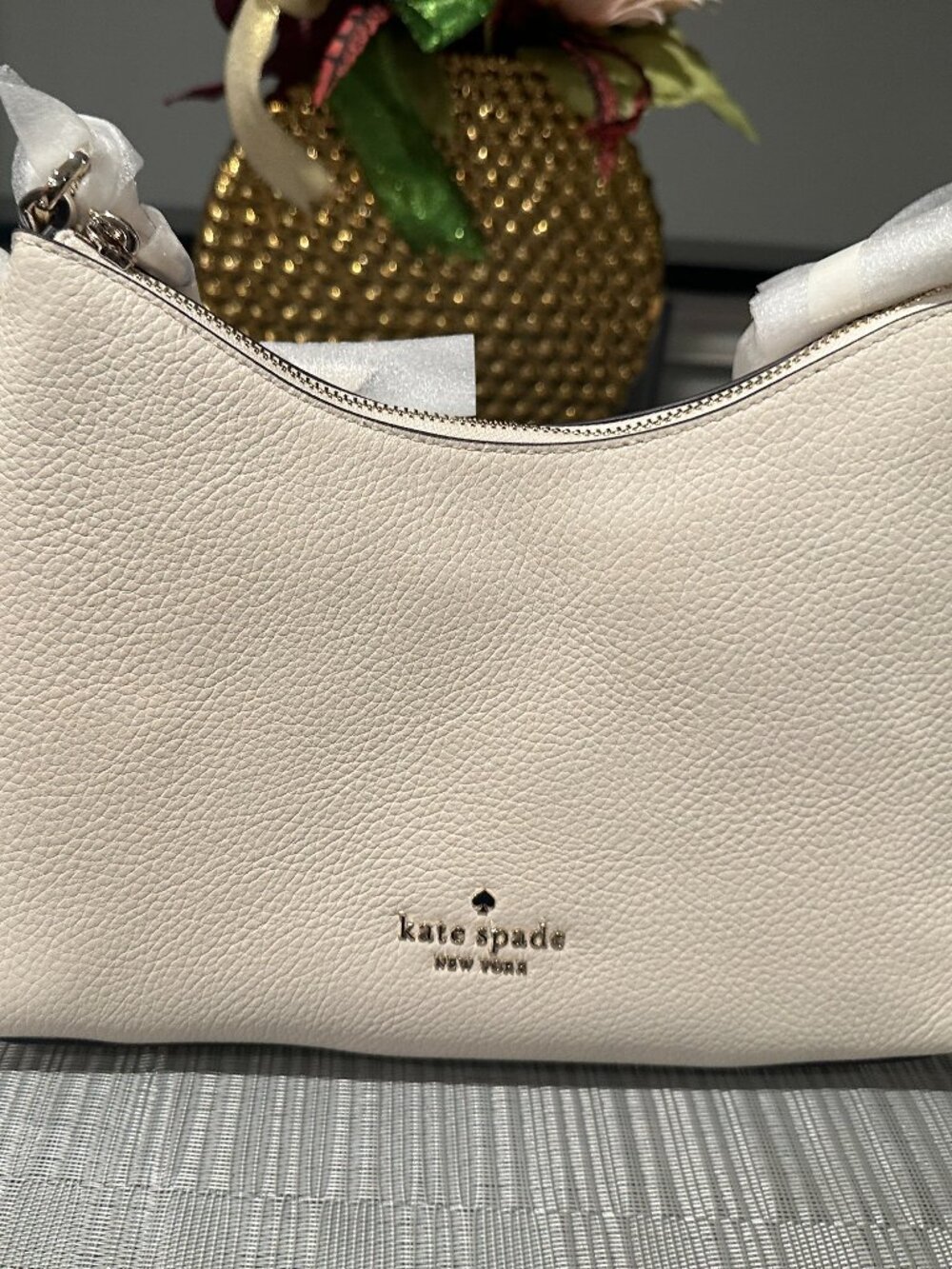 Kate Spade Zippy pebbled leather convertible crossbody bag.